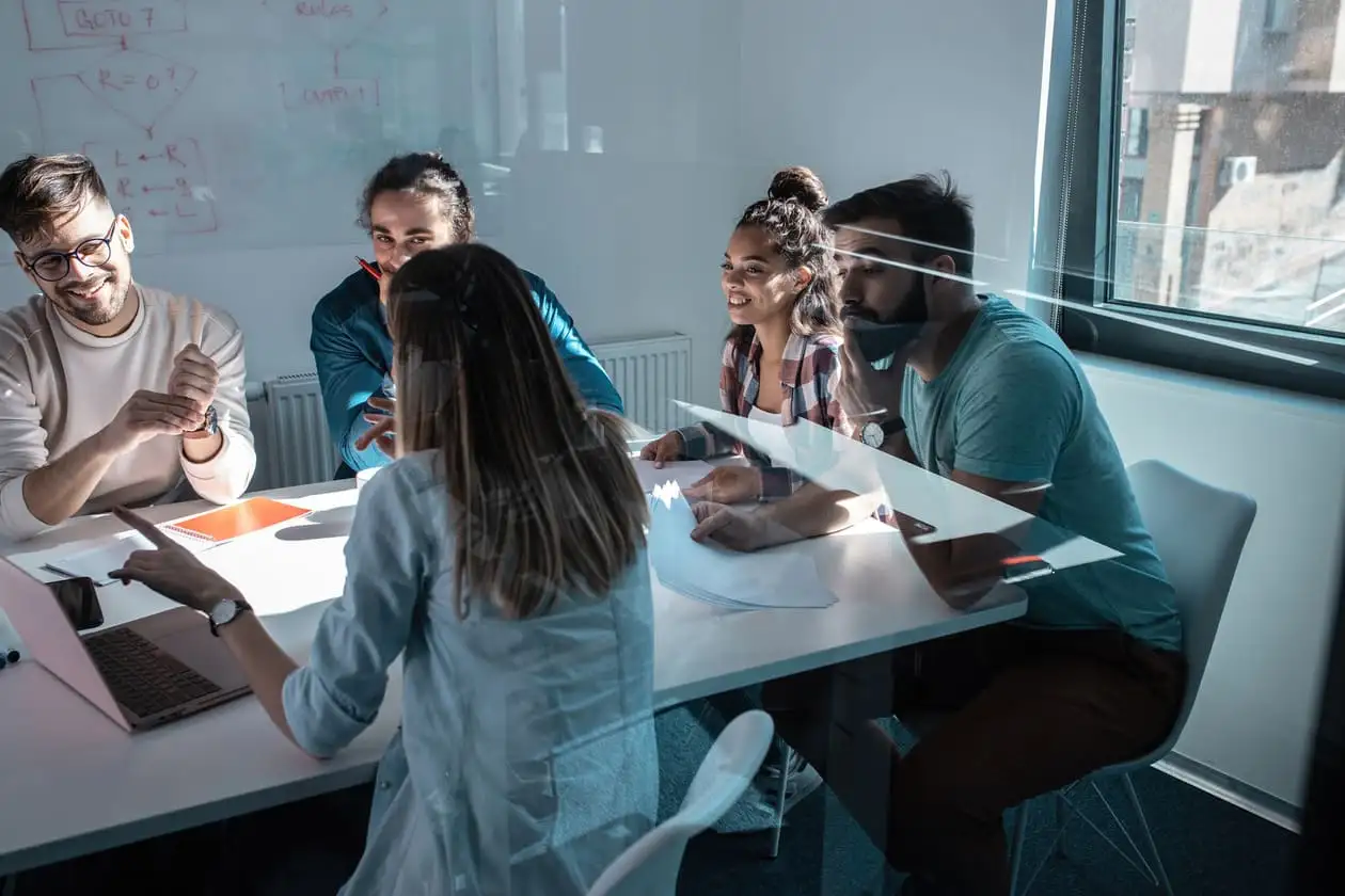 A Good Agency team working through a plan together around a conference table