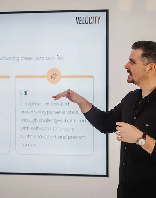 A strategist presenting a quarterly revenue plan at a whiteboard