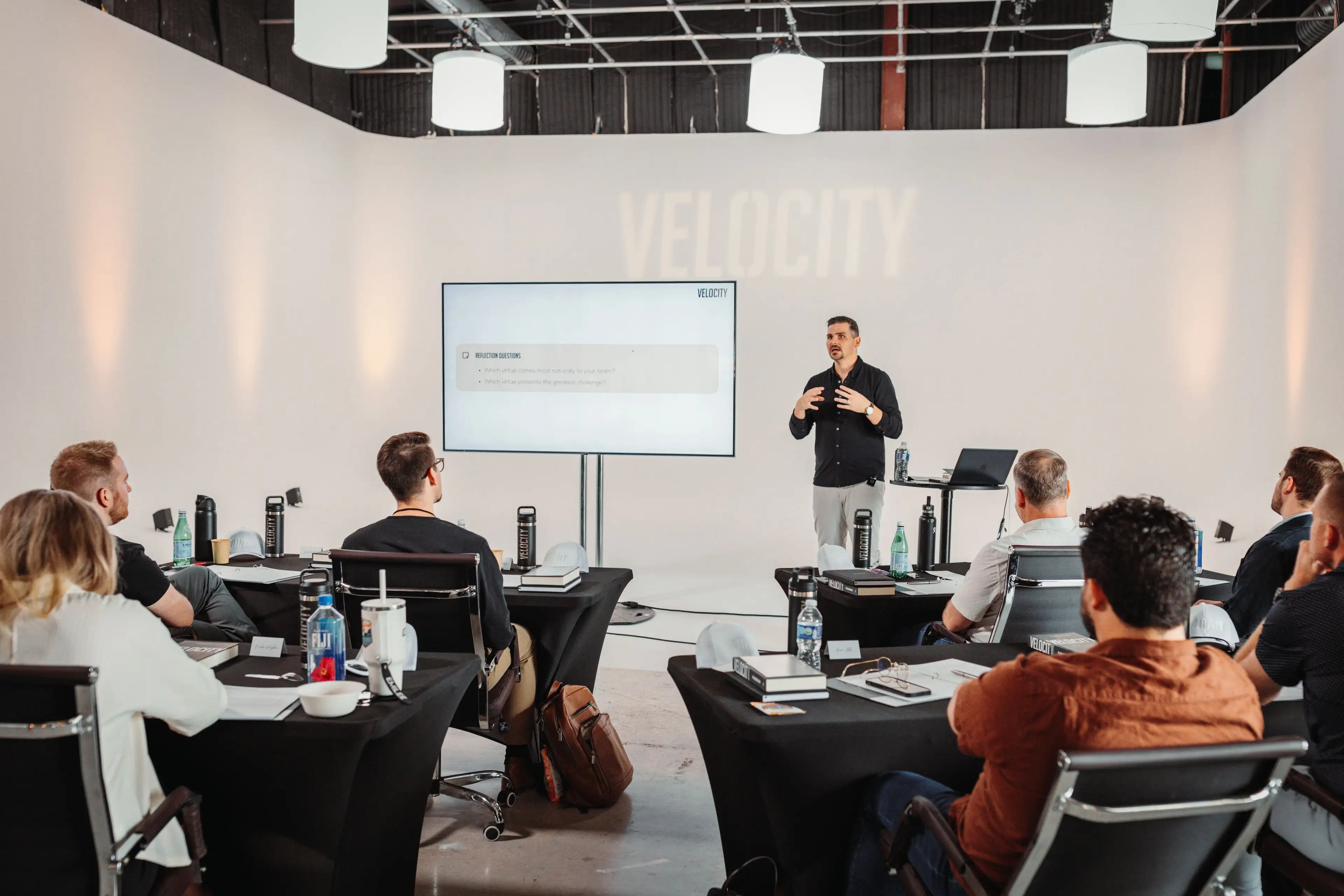 A fractional revenue executive presenting a growth plan to a seated team