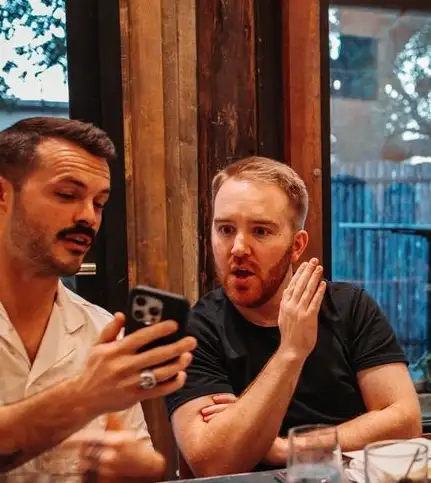 Two advisors working through a revenue plan together